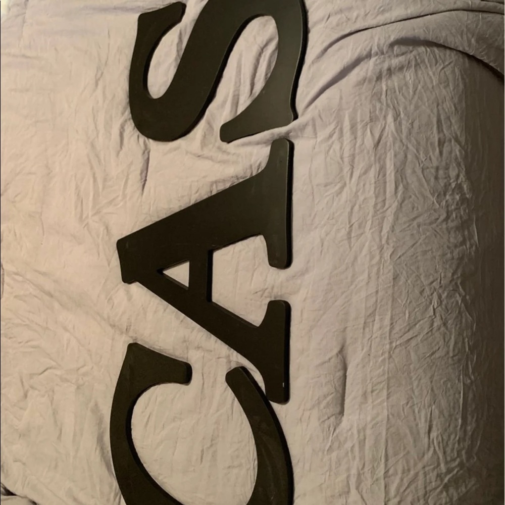 Black Hobby lobby home decor hanging letters.